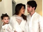 Priyanka Chopra with daughter Malti Marie and husband Nick Jonas during a Holi party in Noida. Priyanka Chopra with daughter Malti Marie and husband Nick Jonas during a Holi party in Noida.