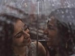 File photo shows Anjali Chakra from India and Sundas Malik from Pakistan under a rain-splattered umbrella. File photo shows Anjali Chakra from India and Sundas Malik from Pakistan under a rain-splattered umbrella.