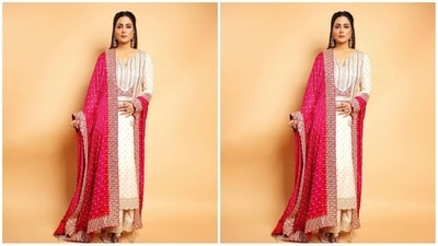 Her outfit, picked from the shelves of clothing brand Faabiiana, featured an ivory full-sleeved kurta with intricate gold embroidery and sequin work adding a touch of glamour. She teamed it with a stunning pink duppata embellished with gold borders and a matching pair of trousers. (Instagram/@realhinakhan) Her outfit, picked from the shelves of clothing brand Faabiiana, featured an ivory full-sleeved kurta with intricate gold embroidery and sequin work adding a touch of glamour. She teamed it with a stunning pink duppata embellished with gold borders and a matching pair of trousers. (Instagram/@realhinakhan)