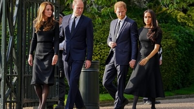 Britain's Prince William, second left, Kate, Princess of Wales, left, Britain's Prince Harry, second right, and Meghan, Duchess of Sussex view the floral tributes for the late Queen Elizabeth II outside Windsor Castle, in Windsor, England on Sept. 10, 2022. (AP Photo/Martin Meissner, File) (AP) Britain's Prince William, second left, Kate, Princess of Wales, left, Britain's Prince Harry, second right, and Meghan, Duchess of Sussex view the floral tributes for the late Queen Elizabeth II outside Windsor Castle, in Windsor, England on Sept. 10, 2022. (AP Photo/Martin Meissner, File) (AP)