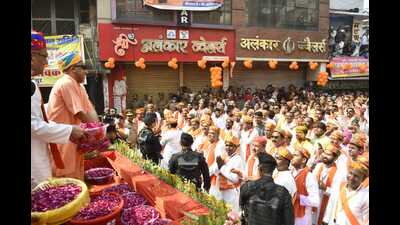 CM Yogi Adityanath showering petals and gulal on locals in Gorakhpur on Tuesday. (HT Photo) CM Yogi Adityanath showering petals and gulal on locals in Gorakhpur on Tuesday. (HT Photo)