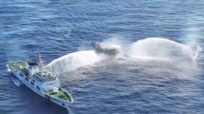 In this frame grab from aerial video footage taken on March 5, 2024 and released by the Philippine Coast Guard (PCG), Chinese Coast Guard ships (L and R) deploy water cannons at the Philippine military-chartered civilian boat Unaizah May 4 (C) during its supply mission near Second Thomas Shoal in the disputed South China Sea. (AFP) In this frame grab from aerial video footage taken on March 5, 2024 and released by the Philippine Coast Guard (PCG), Chinese Coast Guard ships (L and R) deploy water cannons at the Philippine military-chartered civilian boat Unaizah May 4 (C) during its supply mission near Second Thomas Shoal in the disputed South China Sea. (AFP)