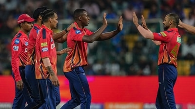 Punjab Kings' Kagiso Rabada with teammates celebrates the wicket of Royal Challengers Bengaluru batter Faf du Plessis (PTI) Punjab Kings' Kagiso Rabada with teammates celebrates the wicket of Royal Challengers Bengaluru batter Faf du Plessis (PTI)