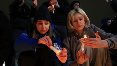 People light candles in memory of the victims of the terrorist attack in Moscow, in the center of in the center of Simferopol, in Russian-held Crimea on Friday. (AP) People light candles in memory of the victims of the terrorist attack in Moscow, in the center of in the center of Simferopol, in Russian-held Crimea on Friday. (AP)