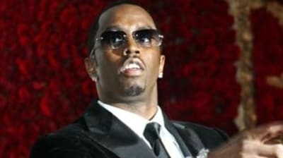 This November 4, 2004, file photo shows Sean ‘P. Diddy’ Combs directing photographers as they sing "Happy Birthday," to him as his date Kim Porter, left, listens, after Combs arrived for his 35th birthday celebration at Cipriani on Wall Street in New York. (AP) This November 4, 2004, file photo shows Sean ‘P. Diddy’ Combs directing photographers as they sing "Happy Birthday," to him as his date Kim Porter, left, listens, after Combs arrived for his 35th birthday celebration at Cipriani on Wall Street in New York. (AP)