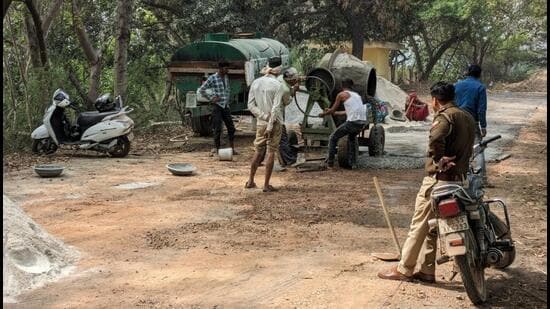 Around a fortnight ago, the irrigation department began constructing a 1-km approach road inside the sanctuary to access the crematorium. However, birders objected, noting that any construction work and the entry of vehicles is prohibited inside the sanctuary, and the ongoing work was thus a violation. (HT Photo)