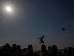 Mumbai, India - March 20, 2024: A boy Jumping in the afternoon heat as temperature soars at Dadar chowpatty in Mumbai, India, on Wednesday, March 20, 2024. (Photo by Satish Bate/ Hindustan Times)(Hindustan Times)