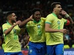 Brazil's midfielder Lucas Paqueta (R) celebrates scoring his team's third goal during the international friendly football match against Spain