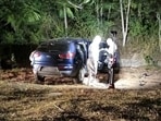 Law enforcement officials work at the scene where Ecuador's youngest mayor, Brigitte Garcia, was found shot dead in a car, according to the police, near San Vicente, Ecuador, in this handout image released on March 24, 2024. 