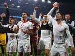 Poland players celebrate winning in a penalty shootout in the UEFA EURO 2024 qualifier play-off final first leg against Wales