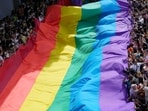 Participants hold a rainbow flag during a Pride Parade in Bangkok.