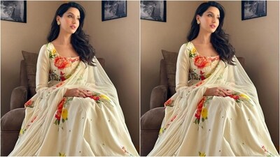 Assisted by hairstylist Madhav Trehan, Nora styled her luscious locks into soft curls and left them open at the side, cascading beautifully down her shoulders and completing her glamorous look. (Instagram/@norafatehi) Assisted by hairstylist Madhav Trehan, Nora styled her luscious locks into soft curls and left them open at the side, cascading beautifully down her shoulders and completing her glamorous look. (Instagram/@norafatehi)