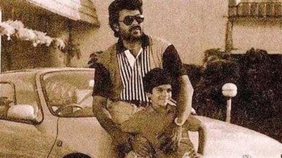 Chiranjeevi looks handsome as he holds his son Ram during a photoshoot from several years ago. Chiranjeevi looks handsome as he holds his son Ram during a photoshoot from several years ago.