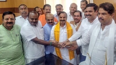 BJP's Pralhad Joshi and Basavaraj Bommai with Janata Dal (Secular) Karnataka President HD Kumaraswamy. (ANI) BJP's Pralhad Joshi and Basavaraj Bommai with Janata Dal (Secular) Karnataka President HD Kumaraswamy. (ANI)