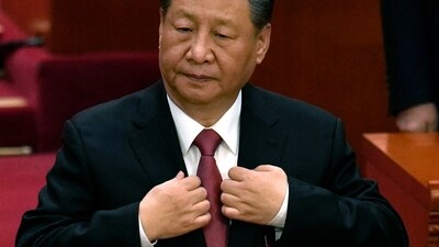 Chinese President Xi Jinping adjusts his jacket during the closing session of the National People's Congress held at the Great Hall of the People in Beijing. (AP) Chinese President Xi Jinping adjusts his jacket during the closing session of the National People's Congress held at the Great Hall of the People in Beijing. (AP)
