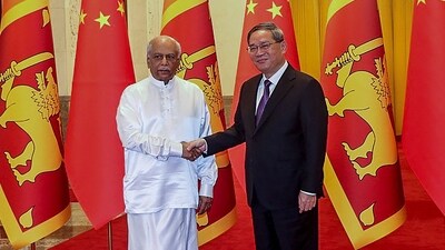 Sri Lanka's Prime Minister Dinesh Gunawardena (L) and China's Premier Li Qiang shake hands before their meeting in Beijing. (AFP) Sri Lanka's Prime Minister Dinesh Gunawardena (L) and China's Premier Li Qiang shake hands before their meeting in Beijing. (AFP)