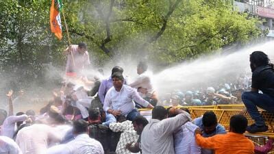 Delhi Police use water cannon to disperse BJP workers during protest demanding the resignation of chief minister Arvind Kejriwal. (HT PHOTO) Delhi Police use water cannon to disperse BJP workers during protest demanding the resignation of chief minister Arvind Kejriwal. (HT PHOTO)