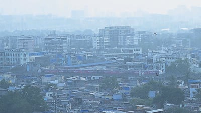 Mumbai, India - Oct 26, 2023 : A Metro train passing in a Slums area in the Air Pollution at Andheri, in Mumbai, India, Thursday, Oct 26, 2023. (Photo by Vijay Bate/HT Photo) Mumbai, India - Oct 26, 2023 : A Metro train passing in a Slums area in the Air Pollution at Andheri, in Mumbai, India, Thursday, Oct 26, 2023. (Photo by Vijay Bate/HT Photo)