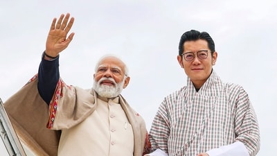 **EDS: IMAGE VIA PIB** Paro: Prime Minister Narendra Modi with the King of Bhutan Jigme Khesar Namgyel Wangchuck waves to the gathering at the Paro International Airport as he departs for New Delhi, in Paro, Bhutan, Saturday, March 23, 2024. (PTI Photo) (PTI03_23_2024_000244B) (PTI) **EDS: IMAGE VIA PIB** Paro: Prime Minister Narendra Modi with the King of Bhutan Jigme Khesar Namgyel Wangchuck waves to the gathering at the Paro International Airport as he departs for New Delhi, in Paro, Bhutan, Saturday, March 23, 2024. (PTI Photo) (PTI03_23_2024_000244B) (PTI)