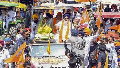 Shiromani Akali Dal (SAD) leaders Harsimrat Kaur Badal and Sukhbir Singh Badal during a road show ahead of the Lok Sabha polls, in Mansa on Wednesday. (PTI)