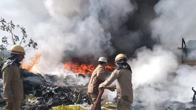 Since the fire started in a vacant plot outside the company compound, where they dump their waste, no one was present at the plot and, hence, no injuries were reported, fire personnel said. (HT Photo) Since the fire started in a vacant plot outside the company compound, where they dump their waste, no one was present at the plot and, hence, no injuries were reported, fire personnel said. (HT Photo)