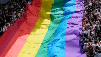 Participants hold a rainbow flag during a Pride Parade in Bangkok. (AP) Participants hold a rainbow flag during a Pride Parade in Bangkok. (AP)