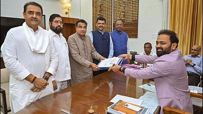 Union minister and BJP candidate Nitin Gadkari files his nomination papers for the upcoming Lok Sabha elections in the presence of Maharashtra chief minister Eknath Shinde and deputy CM Devendra Fadnavis in Nagpur on Wednesday. (PTI) Union minister and BJP candidate Nitin Gadkari files his nomination papers for the upcoming Lok Sabha elections in the presence of Maharashtra chief minister Eknath Shinde and deputy CM Devendra Fadnavis in Nagpur on Wednesday. (PTI)