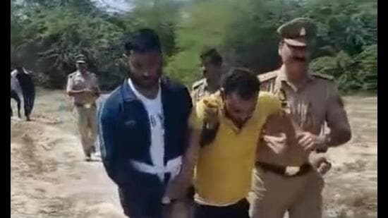 One of the accused being taken away by the police. (Sourced)