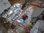 A man inspects the damage in his house in the southern Lebanese village of Marwahin, close to the southern Lebanese border with Israel on November 24, 2023. Since the Gaza war erupted on October 7, Lebanon's southern border with Israel has witnessed deadly exchanges of fire, primarily involving the Israeli army and Lebanon's Hezbollah movement, as well as Palestinian militant groups. (Photo by AFP)