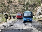 Security personnel inspect the site of a suicide attack near Besham city in the Shangla district of Khyber Pakhtunkhwa province. (AFP) Security personnel inspect the site of a suicide attack near Besham city in the Shangla district of Khyber Pakhtunkhwa province. (AFP)
