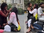 Preeti and Vineeta applying colours to each other. Preeti and Vineeta applying colours to each other.