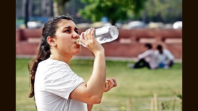 A woman drinks water on a hot afternoon at India Gate on Thursday afternoon. (Sanjeev Verma/HT Photo) A woman drinks water on a hot afternoon at India Gate on Thursday afternoon. (Sanjeev Verma/HT Photo)