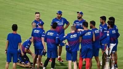 Royal Challengers Bengaluru's players attend a practice session on the eve of their Indian Premier League (IPL) Twenty20 cricket match against Kolkata Knight Riders (AFP) Royal Challengers Bengaluru's players attend a practice session on the eve of their Indian Premier League (IPL) Twenty20 cricket match against Kolkata Knight Riders (AFP)