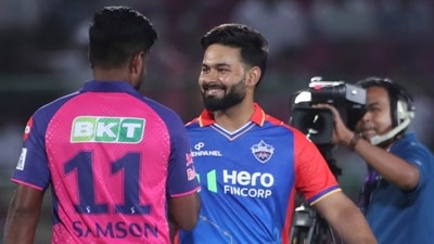 Delhi Capitals' captain Rishabh Pant, facing the camera, talks to Rajasthan Royals' captain Sanju Samson at the coin toss (AP)