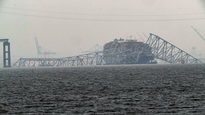 A container ship rests against the wreckage of the Francis Scott Key Bridge on Thursday, March 28, 2024, in Baltimore, Md. After days of searching through murky water for the workers missing after the bridge collapsed, officials are turning their attention Thursday to what promises to be a massive salvage operation. (AP Photo/Matt Rourke) (AP) A container ship rests against the wreckage of the Francis Scott Key Bridge on Thursday, March 28, 2024, in Baltimore, Md. After days of searching through murky water for the workers missing after the bridge collapsed, officials are turning their attention Thursday to what promises to be a massive salvage operation. (AP Photo/Matt Rourke) (AP)