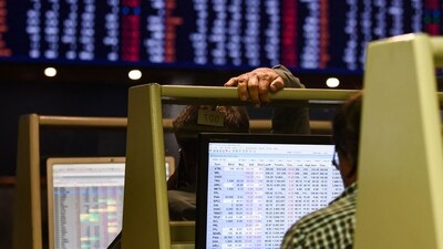 Stock brokers monitor share prices on computers during a trading session at the Pakistan Stock Exchange (PSX) in Karachi. (AFP)