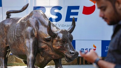 Stock market news: A man walks past the bull statue at BSE building in Mumbai. (PTI) Stock market news: A man walks past the bull statue at BSE building in Mumbai. (PTI)