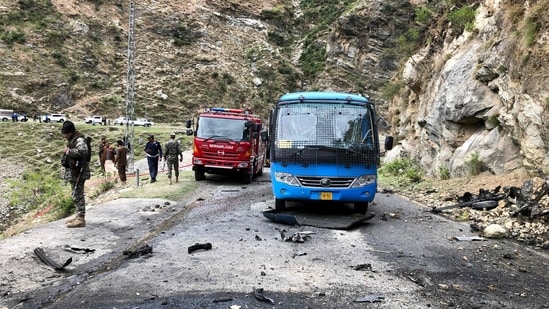 Security personnel inspect the site of a suicide attack near Besham city in the Shangla district of Khyber Pakhtunkhwa province. (AFP)