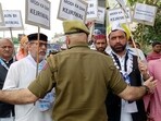 Police personnel tries to stop Aam Aadmi Party supporters protesting against the arrest of Delhi CM and party national convener Arvind Kejriwal by the Enforcement Directorate (ED), in Jammu on Thursday. (ANI Photo)