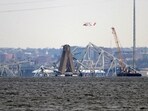 A crane is seen near the wreckage of the Francis Scott Key Bridge on Friday(AP)