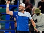 Grigor Dimitrov of Bulgaria celebrates after defeating Carlos Alcaraz of Spain during the Miami Open tennis tournament