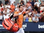 Andy Murray of Great Britain waves to the crowd after losing in three sets against Tomas Machac of the Czech Republic on Day 9 of the Miami Open 