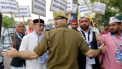 Police personnel tries to stop Aam Aadmi Party supporters protesting against the arrest of Delhi CM and party national convener Arvind Kejriwal by the Enforcement Directorate (ED), in Jammu on Thursday. (ANI Photo) (Makhan Jammu) Police personnel tries to stop Aam Aadmi Party supporters protesting against the arrest of Delhi CM and party national convener Arvind Kejriwal by the Enforcement Directorate (ED), in Jammu on Thursday. (ANI Photo) (Makhan Jammu)