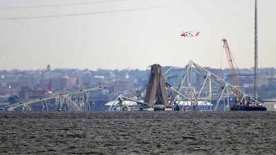 A crane is seen near the wreckage of the Francis Scott Key Bridge on Friday (AP) A crane is seen near the wreckage of the Francis Scott Key Bridge on Friday (AP)