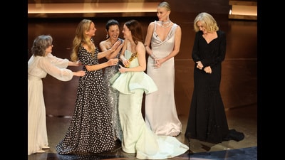 Emma Stone is handed the Oscar for best actress, for Poor Things, by previous winners Sally Field, Jennifer Lawrence, Michelle Yeoh, Charlize Theron and Jessica Lange. (Reuters) Emma Stone is handed the Oscar for best actress, for Poor Things, by previous winners Sally Field, Jennifer Lawrence, Michelle Yeoh, Charlize Theron and Jessica Lange. (Reuters)