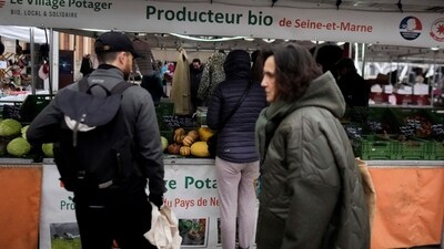 People shop at an organic food seller in an open air market in Fontainebleau, south of Paris, France. (AP) People shop at an organic food seller in an open air market in Fontainebleau, south of Paris, France. (AP)