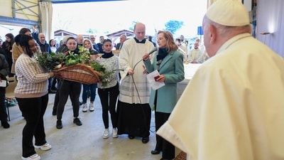 In this photo, Pope Francis can be seen being welcomed at the Rebibbia prison for women in Rome where he performed the "Washing of the Feet" of inmates during a private visit as part of Holy Thursday, during Easter celebrations. (AFP) In this photo, Pope Francis can be seen being welcomed at the Rebibbia prison for women in Rome where he performed the "Washing of the Feet" of inmates during a private visit as part of Holy Thursday, during Easter celebrations. (AFP)