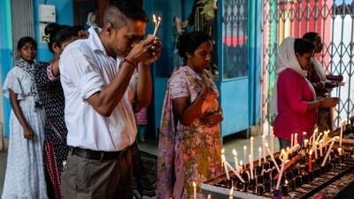 Christians light candles as they pray at a church on Good Friday in Kolkata. (AP) Christians light candles as they pray at a church on Good Friday in Kolkata. (AP)