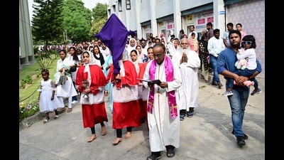 Members of the Christian community during a Good Friday procession at Christ the King Cathedral in Sector 19, Chandigarh, on Friday. (Ravi Kumar/HT)