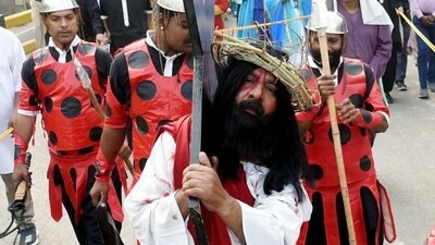Christian devotees take part in a procession marking Good Friday in Patna. (PTI) Christian devotees take part in a procession marking Good Friday in Patna. (PTI)